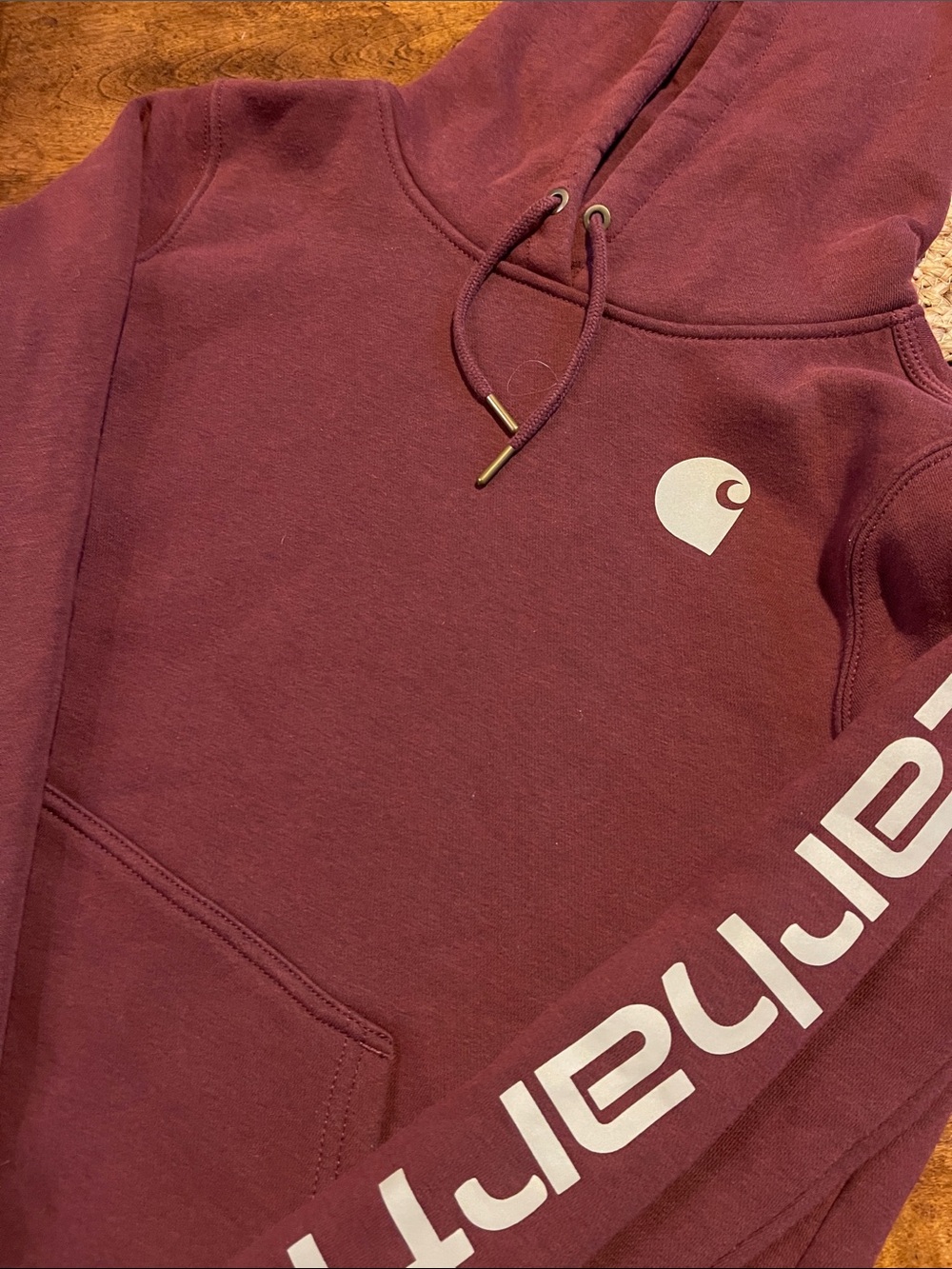 Like new-worn one time. Carhartt Men’s Burgundy Pullover Hoodie with Sleeve Logo